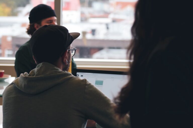 Startup team reviewing technology insurance and cyber requirements