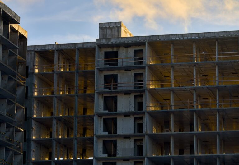 A tall building sitting next to a parking lot